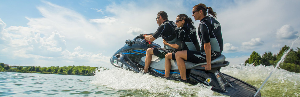 Three people riding a jetski